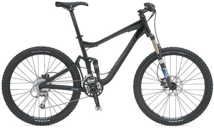 Giant Trance X2: Mountain bike with a black frame, sturdy tires, front suspension fork, and multiple gears, positioned on a white background.