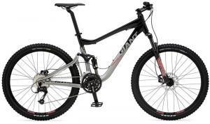 Giant Trance X4: A mountain bike with a black and silver frame, featuring thick tires, a front suspension fork, and multiple gears, designed for off-road riding.
