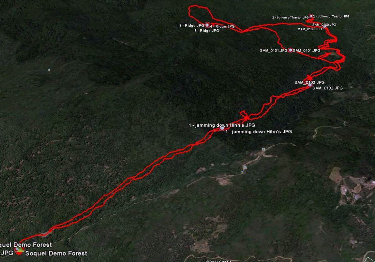 Aerial map of the Soquel Demo Forest with a series of marked trails highlighted in red, indicating specific paths and points of interest, including images and descriptions labeled along the route. Forest Of Nisene Marks and Soquel Demonstration Forest mountain bike trail.