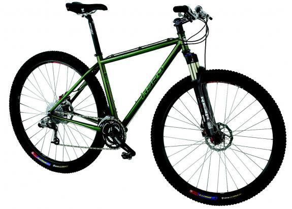 Haro Mary XC: A green mountain bike with a sturdy aluminum frame, featuring front suspension, disc brakes, and wide tires designed for off-road terrain. The bike is positioned on a plain background, showcasing its design and components.