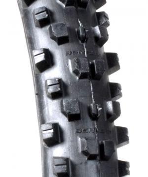 ITS Intruder: Close-up view of a textured mountain bike tire, highlighting its aggressive tread pattern designed for traction and grip on rough terrain.