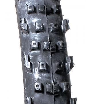 ITS System 5: Close-up image of a bicycle tire tread, featuring a textured surface with small, square studs designed for enhanced grip and traction on rough terrain.