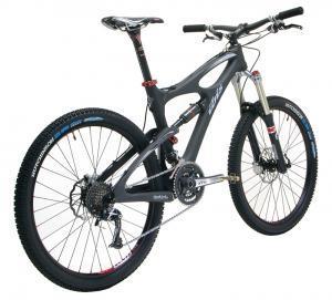 Ibis Mojo SL: A modern mountain bike with a sleek black frame, suspension fork, and disc brakes. The bike features thick tires designed for off-road terrain and a gear system for different speeds.