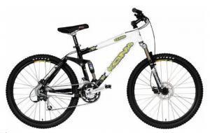 Kona Bear: Mountain bike with a black and white frame, featuring thick tires, front suspension, and multiple gears. The bike is designed for off-road cycling.