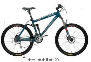 Kona Dawg Primo: A blue mountain bike with thick tires, dual suspension, and a modern frame design, positioned against a white background.