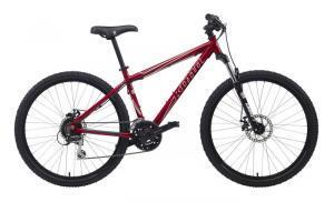 A red mountain bike with dual suspension, disc brakes, and a sleek design, positioned upright against a white background.