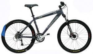 Kona Hoss: A gray mountain bike with black tires, featuring a sturdy frame, disc brakes, and a comfortable saddle, positioned on a white background.