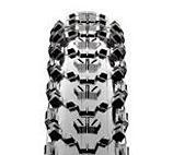 Maxxis Ardent: Close-up view of a motorcycle tire tread with a detailed pattern, showcasing its grooves and design for traction. The image captures the tire's cross-section from a top-down perspective, emphasizing the intricate lines and shapes.