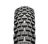 Maxxis Creepy Crawler: Close-up view of a motorcycle tire showcasing its tread pattern and texture.