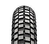 Maxxis Holy Roller: Close-up view of a textured motorcycle tire, showcasing its tread pattern for enhanced grip and traction.