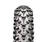 Maxxis Ignitor UST: Close-up view of a rugged, textured tire showcasing its deep treads and patterns, designed for off-road or motorcycle use. The tire is positioned upright against a plain white background.