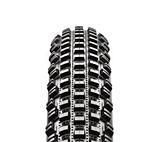 Maxxis Larsen TT UST: Close-up view of a motorcycle tire showcasing its tread pattern, designed for off-road performance. The tire features deep grooves and lugs for enhanced grip on various terrains.