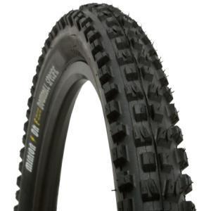 Maxxis Minion DHF: Close-up view of a mountain bike tire with a rugged tread pattern designed for off-road terrain, featuring deep grooves and spikes for enhanced traction.