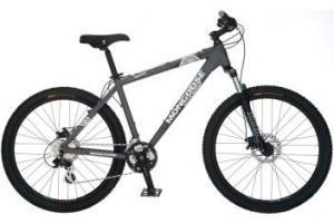 Mongoose Tyax Elite: A gray mountain bike with thick tires, a sturdy frame, and disc brakes, positioned against a plain background.