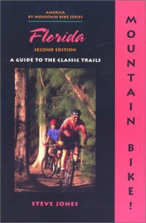 * Mountain Bike! Florida: Book cover for "Florida: A Guide to the Classic Trails," featuring two cyclists riding through a wooded area. The title is prominently displayed in pink, with the subtitle indicating it is the second edition. The author