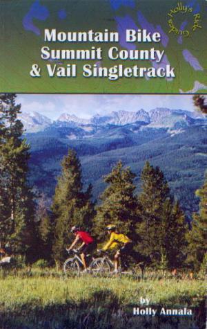 * Mountain Bike Summit County & Vail Singletrack: Cover of a guidebook titled "Mountain Bike Summit County & Vail Singletrack" by Holly Annala, featuring two mountain bikers riding on a dirt trail surrounded by lush trees and a scenic mountain backdrop.