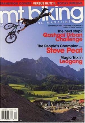 * Mountain Biking: Cover of "MT Biking" magazine featuring a mountain biker performing a trick mid-air above a scenic landscape with mountains and valleys. The cover includes headlines about biking challenges and events.