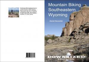 * Mountain Biking Southeastern Wyoming: Downsized!: Front and back cover of a book titled "Mountain Biking Southeastern Wyoming" by Daniel Darwalter. The front cover features a scenic photograph of rocky terrain, with a person standing on a rock formation in the distance. The title and author