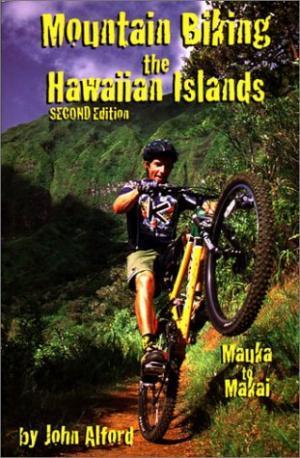 * Mountain Biking the Hawaiian Islands: A book cover for "Mountain Biking the Hawaiian Islands, Second Edition" by John Alford. The cover features a mountain biker performing a wheelie on a trail surrounded by lush greenery and mountains. The title is prominently displayed in bold yellow text at the top, with "Mauka to Makai" positioned beneath it.