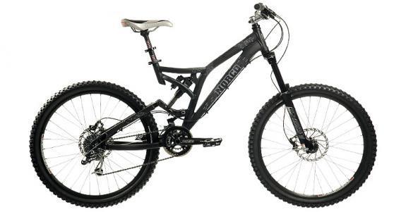 Norco Six Two: A black mountain bike with a dual suspension frame, featuring wide tires, a sleek design, and disc brakes. The bike is positioned upright against a white background, highlighting its components and craftsmanship.