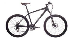 Norco Storm: A black mountain bike with a sturdy frame, disc brakes, and thick tires, positioned against a white background.