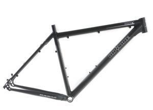 On-One Scandal 29er Vertical Dropouts: A black bicycle frame viewed from the side, showcasing its geometric design and various attachment points. The frame appears lightweight and is intended for mountain biking or similar outdoor activities.