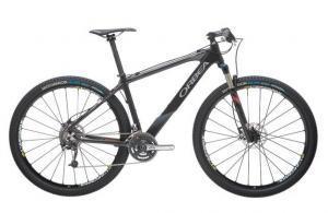 Orbea Alma 29 World Cup: A modern black mountain bike featuring a lightweight frame, suspension fork, disc brakes, and high-traction tires designed for cross-country and off-road cycling.
