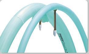 Panaracer Green Lite: Two curved, light blue tubes connected by a vertical metallic rod, with small white caps at the ends of the tubes. The tubes appear flexible and are likely part of a larger structure or system.