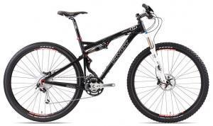 Pivot Mach 429: A black mountain bike with a sleek design, featuring a dual suspension system, wide tires, and disc brakes, showcased on a white background.