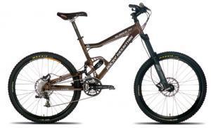 Rocky Mountain Slayer 30: Mountain bike with a brown frame, front suspension fork, and knobby tires, designed for off-road cycling.