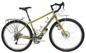 Salsa Fargo: A side view of a yellow-green mountain bike with a sturdy frame, disc brakes, and multiple attachment points for accessories. The bike features a rear rack and is designed for off-road cycling.