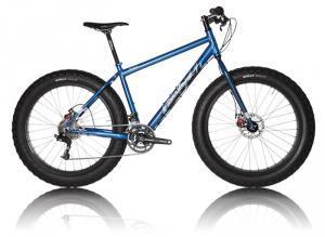 Salsa Mukluk: A blue fat tire mountain bike with a sturdy frame, wide tires, and disc brakes, positioned against a plain background.