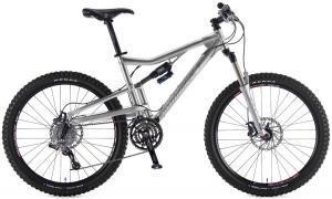 Santa Cruz Heckler: A silver mountain bike with dual suspension, thick tires, and a gear system, positioned on a white background.