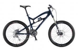 Santa Cruz Nomad: A mountain bike with a blue frame, front suspension, and thick tires, showcasing its durable design for off-road cycling.