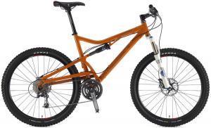 Santa Cruz Superlight: A mountain bike with an orange frame, featuring dual suspension, large tires, and a front suspension fork. The bike is equipped with gears and disc brakes, suitable for off-road cycling.