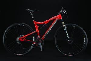 Santa Cruz Tallboy Carbon: A bright red mountain bike with a lightweight frame, front suspension, and sturdy black tires, positioned against a dark background.