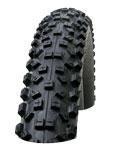 Schwalbe Hans Dampf: Alt text: A close-up image of a black, textured mountain bike tire with pronounced treads, positioned upright.