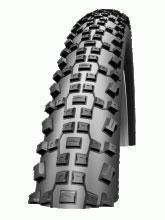Schwalbe Racing Ralph: A close-up view of a bicycle tire, showcasing its tread pattern and texture designed for traction and stability. The tire features deep grooves and knobs for improved grip on various terrains.