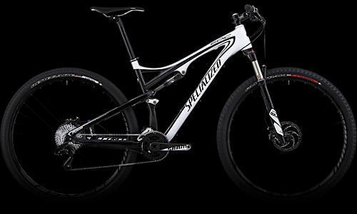 Specialized Epic: A black and white mountain bike with a sleek design, featuring large wheels, a lightweight frame, and dual suspension. The bike is positioned against a dark background, highlighting its modern aesthetics and the "Specialized" branding.