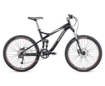 Specialized FSR XC Comp: A black mountain bike with a sleek frame, featuring disc brakes and rugged tires, positioned on a white background.