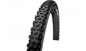 Specialized Ground Control: A close-up view of a black mountain bike tire, featuring a tread pattern designed for improved traction on rough terrain. The tire has prominent knobs and a sturdy sidewall.