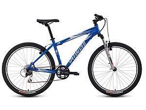 Specialized Rockhopper: A blue mountain bike featuring a sturdy frame, wide tires, and front suspension, suitable for off-road riding.