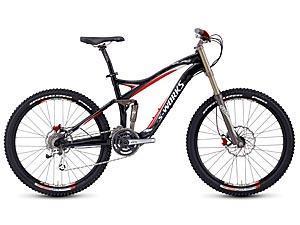 Specialized S-Works Enduro SL Carbon: A sleek black and red mountain bike featuring thick tires, front suspension, and a lightweight frame, designed for off-road cycling.