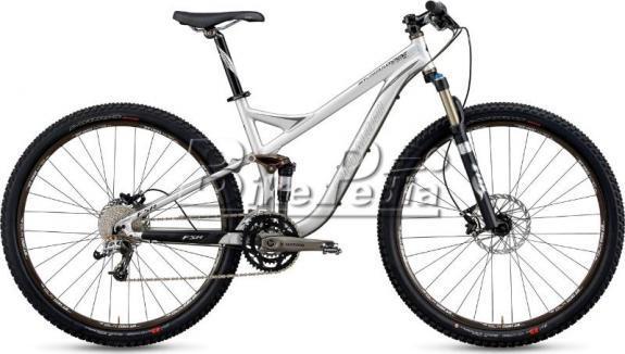 Specialized Stumpjumper: A modern mountain bike with a sleek silver frame, featuring front suspension, wide tires for off-road traction, and a drivetrain designed for varying terrains.
