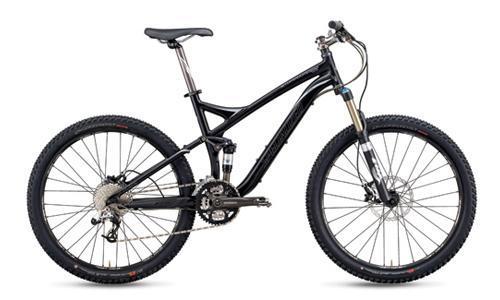 Specialized Stumpjumper: A black mountain bike with a lightweight frame, front suspension, and wide tires, designed for off-road cycling.
