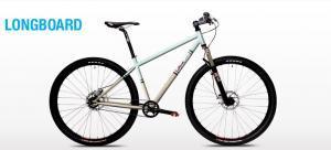 Spot Longboard: A light blue and silver longboard bicycle with thick black tires and a minimalist design, displayed against a white background. The word "LONGBOARD" is prominently featured in blue text above the bike.