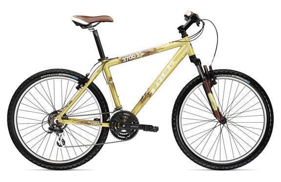 Trek 3700: Mountain bike with a yellow frame, brown seat, and black tires. The bike features a front suspension, multiple gears, and textured grips.