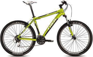 A green and black mountain bike with large wheels, suspension forks, and a sleek design, positioned against a neutral background.