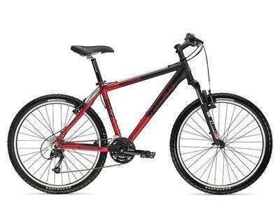 Trek 4500: A red and black mountain bike with a lightweight frame, front suspension, and knobby tires, ideal for outdoor biking and rugged terrain. The bike features a traditional mountain bike design with a comfortable seat and standard handlebars.