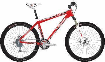 Trek 6000: A red mountain bike with black tires and white accents, featuring a lightweight frame, front suspension, and disc brakes. The bike is shown from the side, highlighting its sleek design and components.